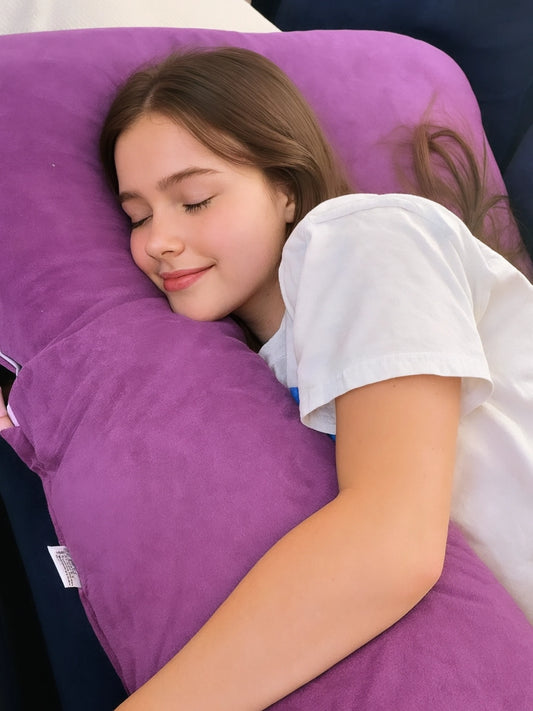 Person resting on a purple HerPillow full-body pillow.