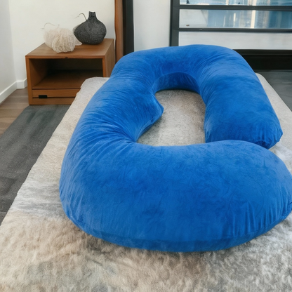 Majestic Blue HerPillow® U-shaped full-body pillow on a bed with a soft, velvety cover.