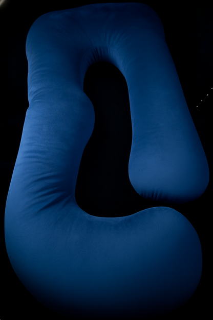 Blue velvet U-shaped full-body pillow on a clean black background.