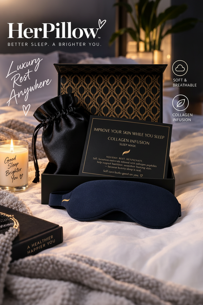 HerPillow luxury sleep care gift set featuring a black and gold patterned box, a navy blue sleep mask, a black drawstring pouch, and a sleep instruction card, styled on a bed with a lit candle and cozy bedding.