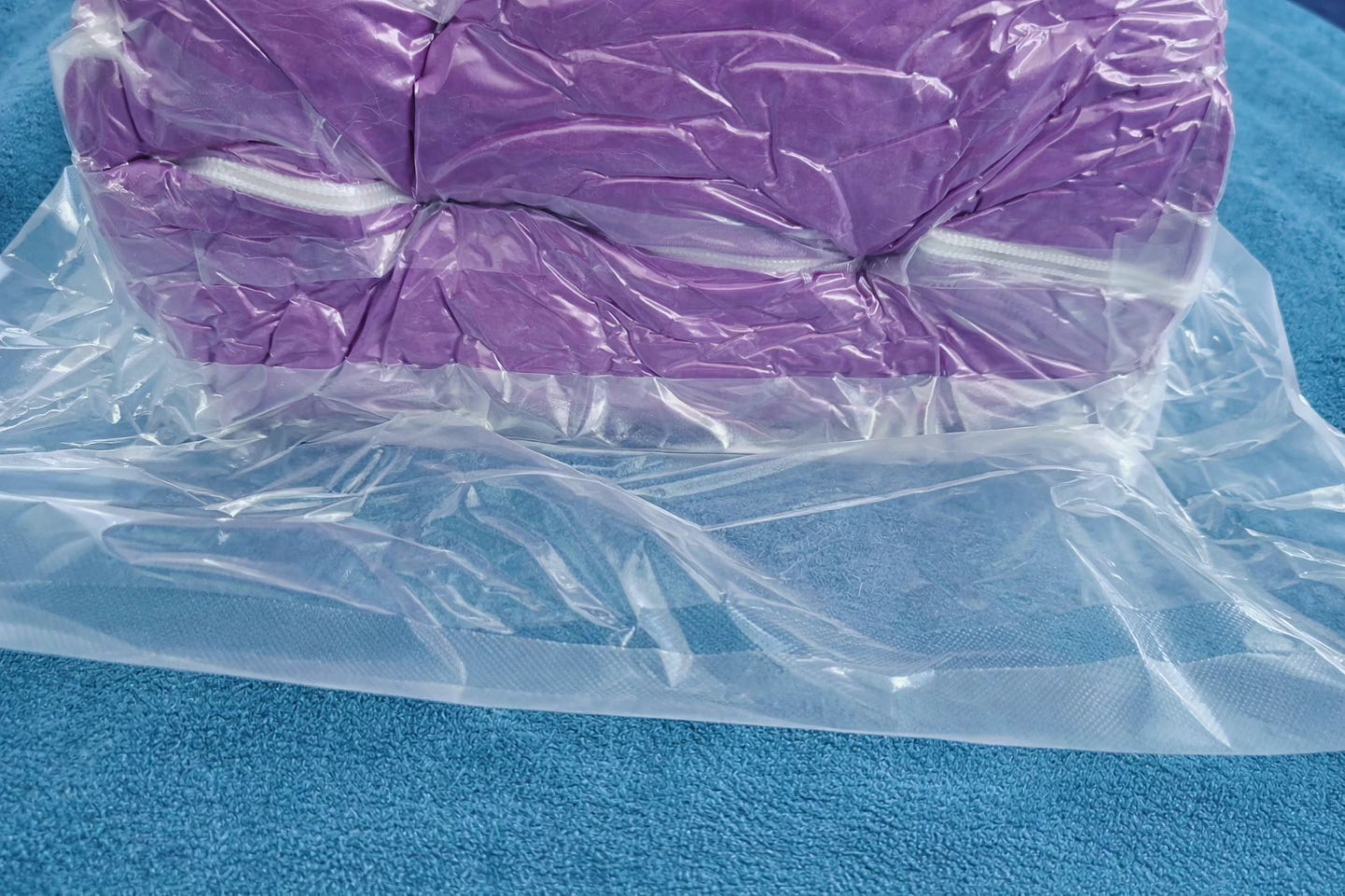Purple HerPillow body pillow compressed in vacuum seal